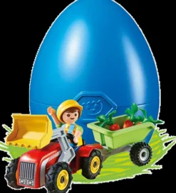 Playmobil poika lasten traktorilla